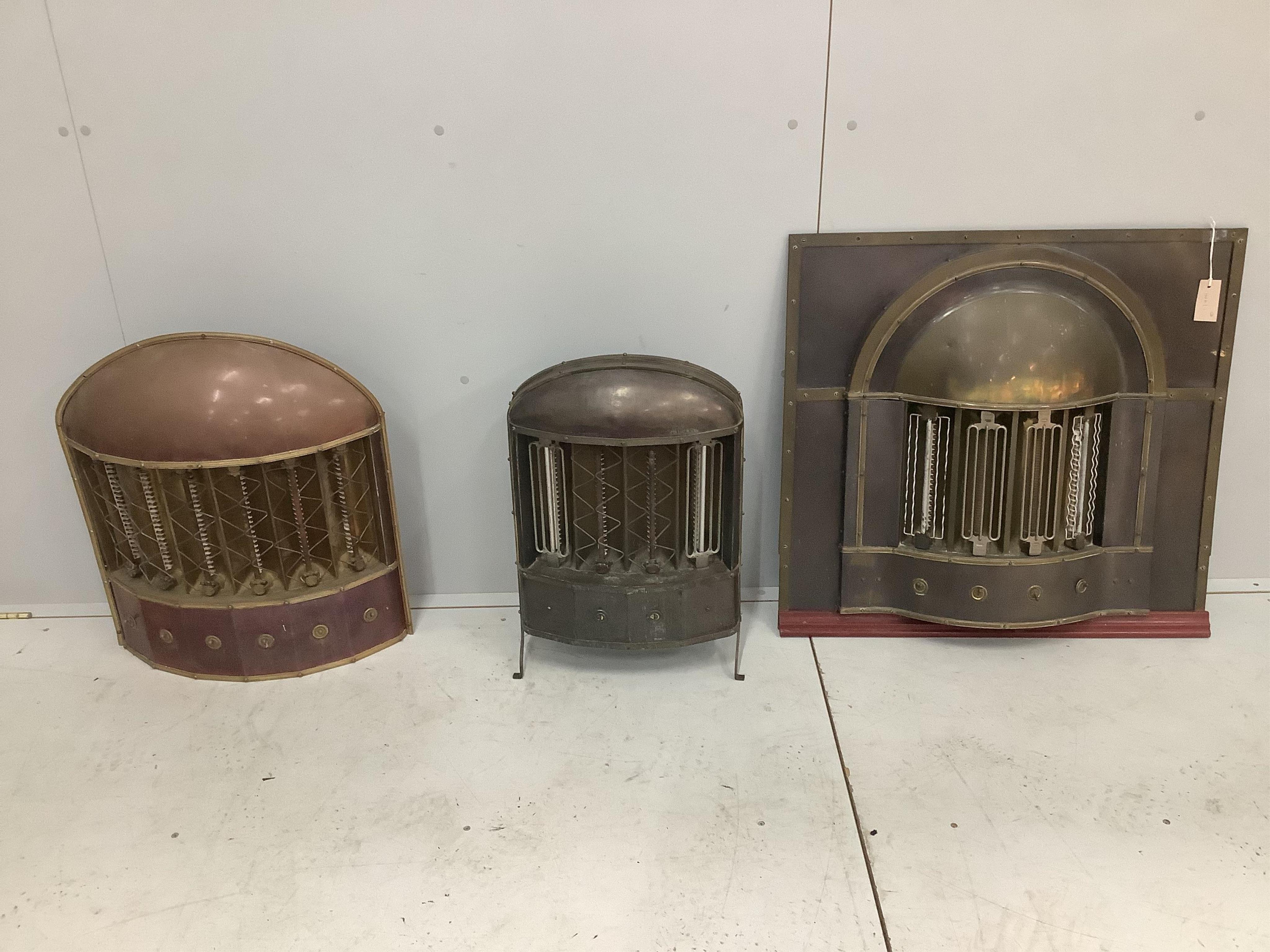 Three early 20th century French brass and copper mounted electric fires, largest width 77cm, height 73cm. Condition - fair